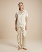 Nocturne Lounge Set — Ivory, female styling with loose slicked-back hair on a plain beige background