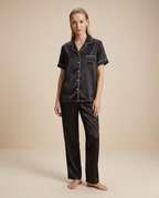 Nocturne Lounge Set — Onyx, female styling with loose slicked-back hair on a plain beige background